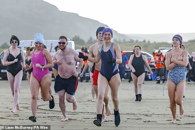 Festive Frolics: Brave Swimmers Mark New Year in Icy Waters of Whitley Bay