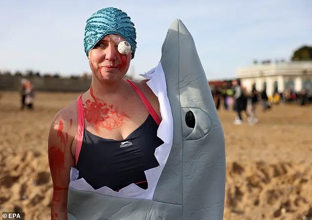 Festive Frolics: Brave Swimmers Mark New Year in Icy Waters of Whitley Bay