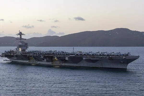 Iran Warns U.S. Carrier Presence in Red Sea Poses Existential Threat, Eyes Targeting Supporting Infrastructure Amid Escalation Fears