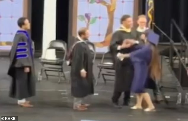 Kansas graduates forced into awkward handshakes by aggressive administrators